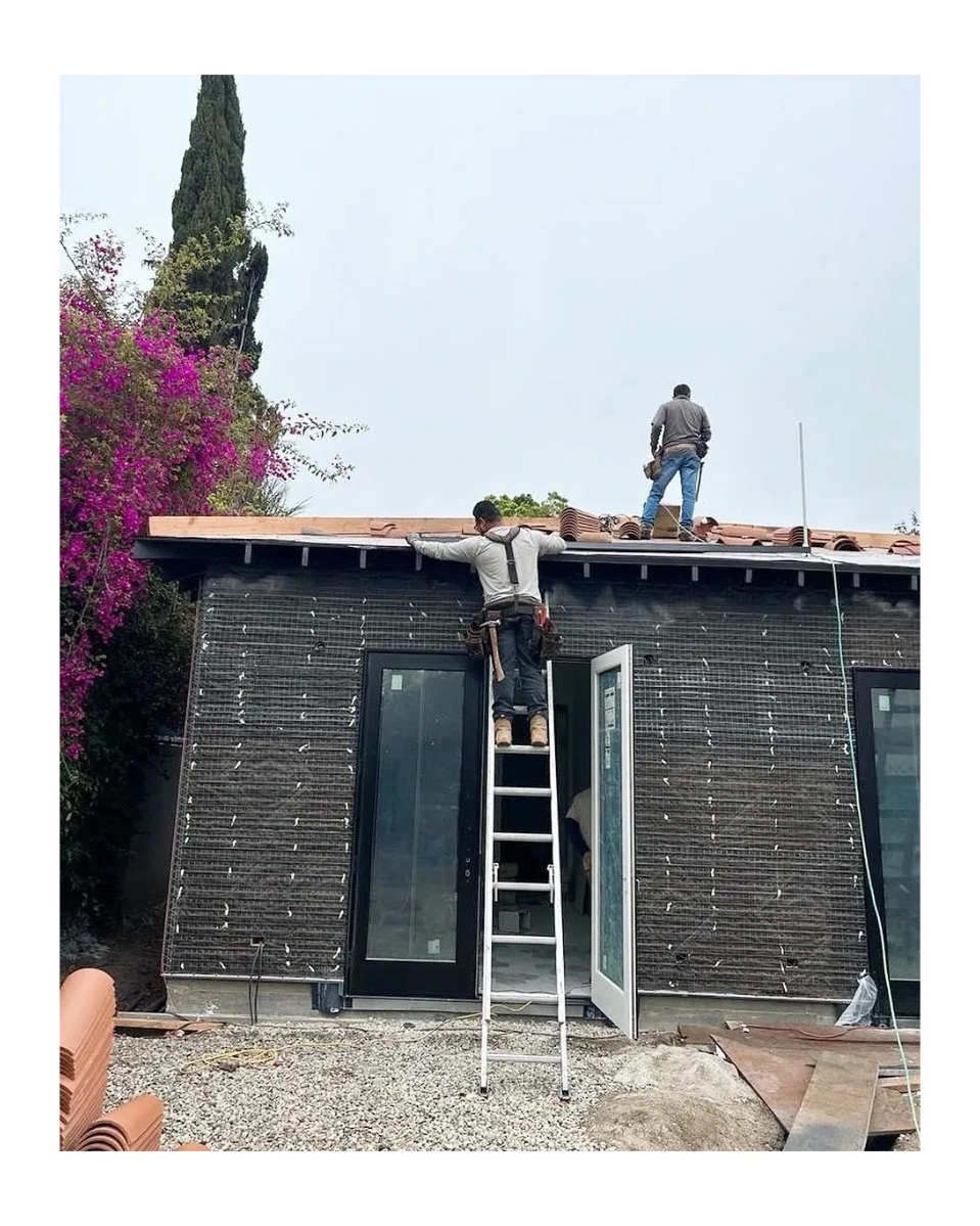 Green Tech crew performing roof work on a residential remodel
